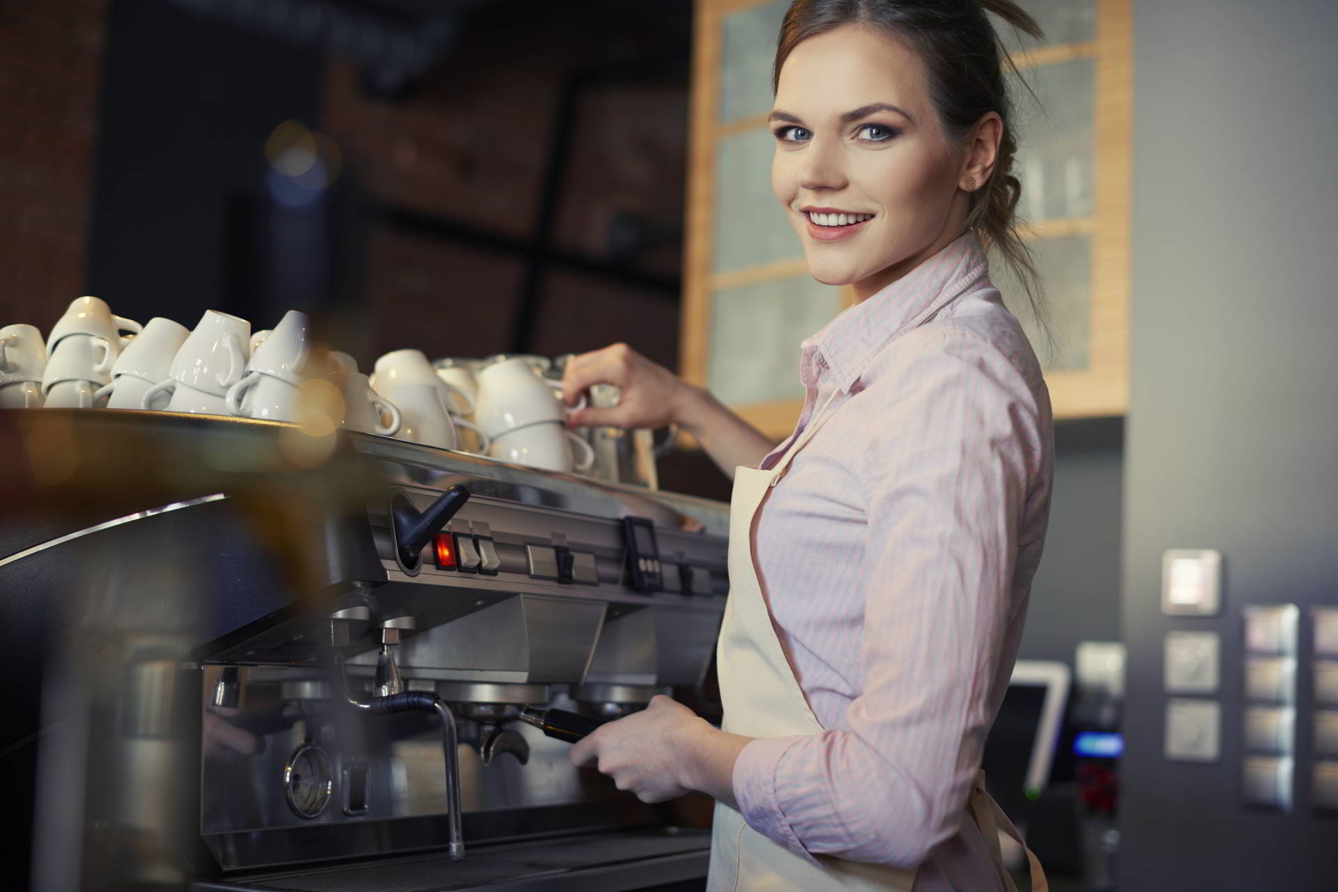 portrait waitress making coffee