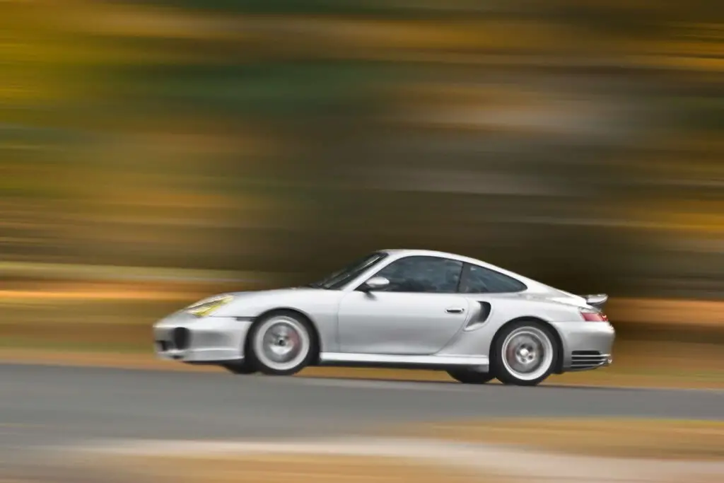 modern sports speeding along road with motion blur effect